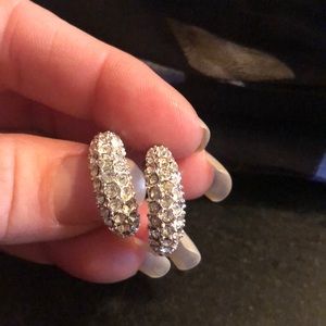 Silver and rhinestone earrings.